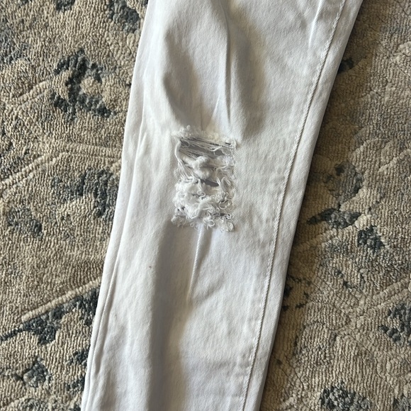 Boys size 10 white jeans with rips in them. - Picture 3 of 6